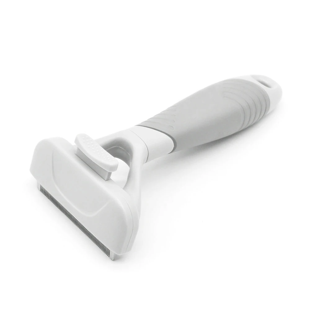 puppy fence indoor next to grooming station with deshedding tool